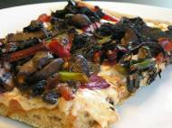 Leftover pizza: pizza sauce, vegan cheese, chard, kale, mushrooms, and onion on spelt and whole wheat crust