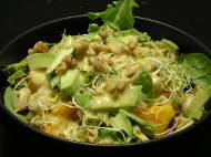 Cannellini bean mixed greens salad with heirloom tomato, avocado, sprouts, red cabbage, radishes, purple bell pepper, walnuts, and tahini-lemon dressing